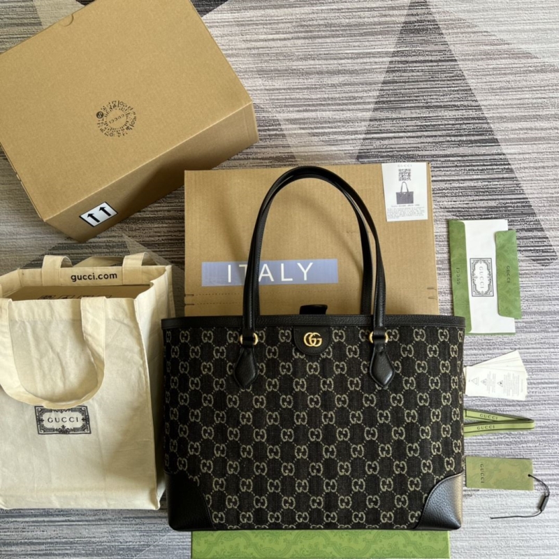 G*u*i shopping bags